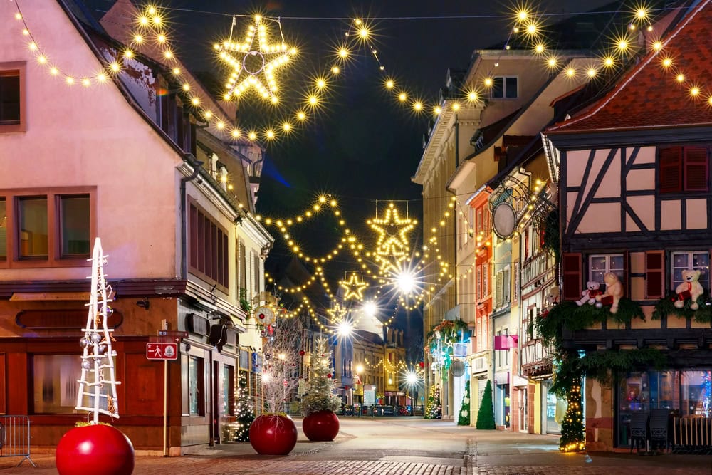 Traditional Alsatian half-timbered houses in old town of Colmar, decorated and illuminated at christmas time, Alsace, France