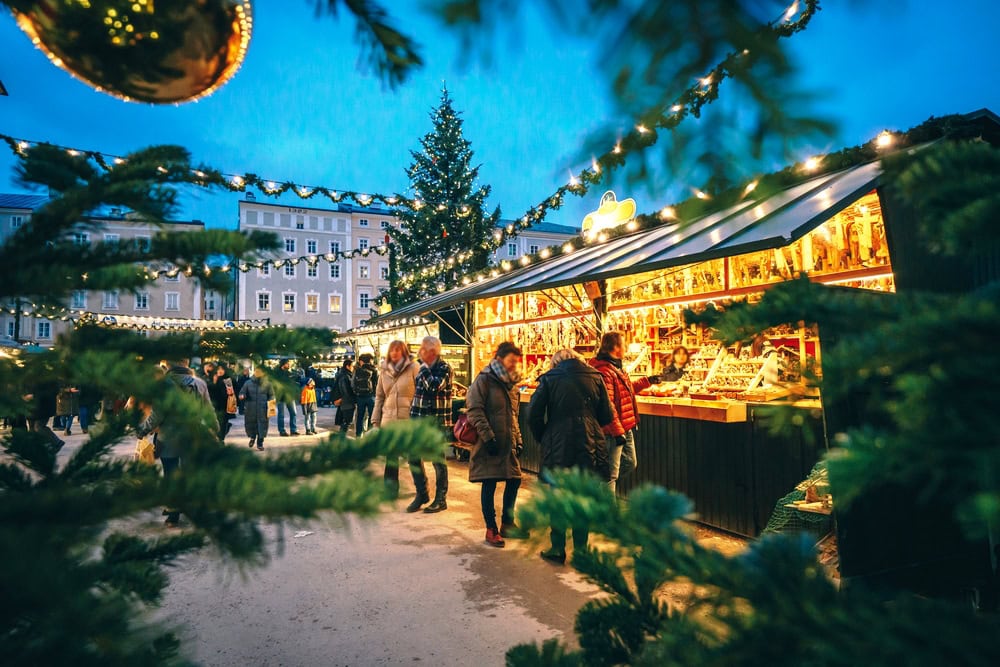 Salzburg Christmas Market seen through a Christmas tree branches