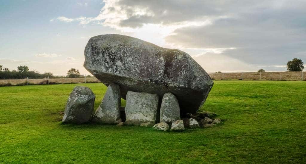 Brownshill Dolmen a series of 5 small stones holding up one much larger in a green field