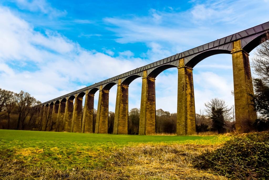 he impressive 18 stone arches and cast iron trough of the Pontcysyllte Aqueduct (the highest in the world) on the Ellesmere canal near Llangollen, Wales