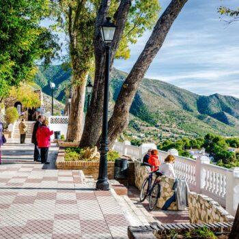 Mijas views of the mountains and a pretty malecon with huge trees