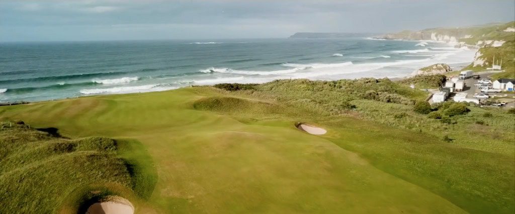 Royal Portrush golf course, greens spreading across a links course with views of the Wild Atlantic Way