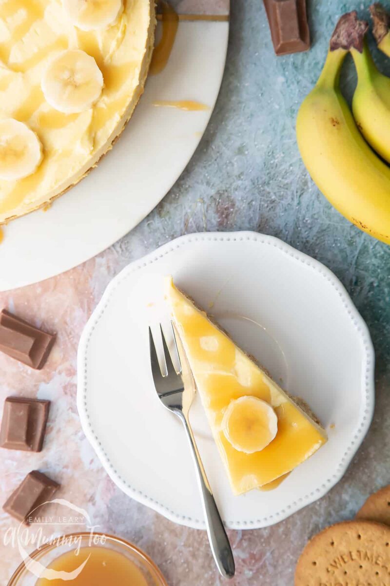 Banoffee pie a triangle of pie on a white plate topped with bananas