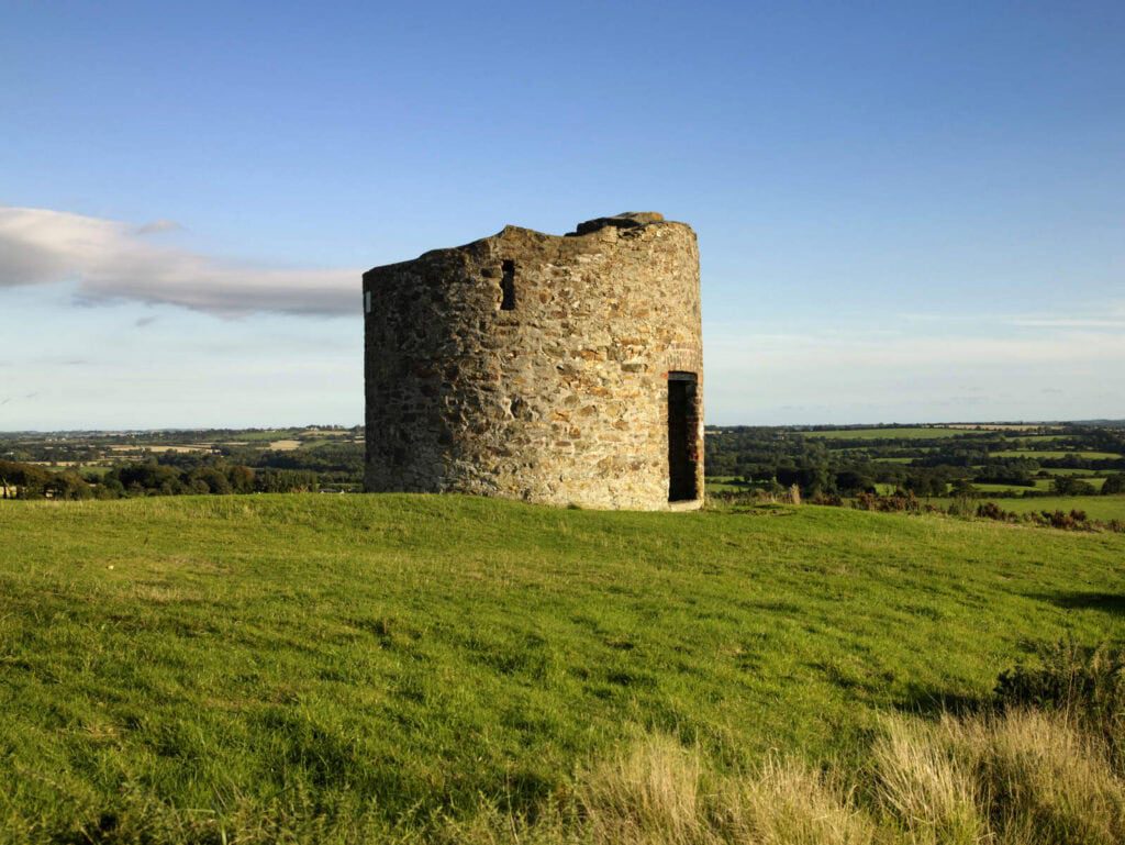 A ruined tower known as Vinegar Hill sits on a hill with panormaic views of the Wexford countryside