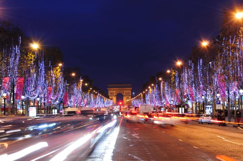 Champs Elysee with Arc de Triomphe Paris at Christmas the trees along the road are all lit up with fairy lights