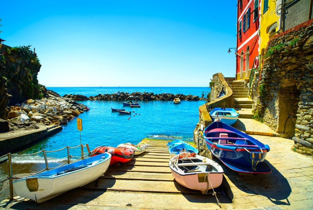 Riomaggiore village street, boats and sea. Cinque Terre, Ligury, Italy