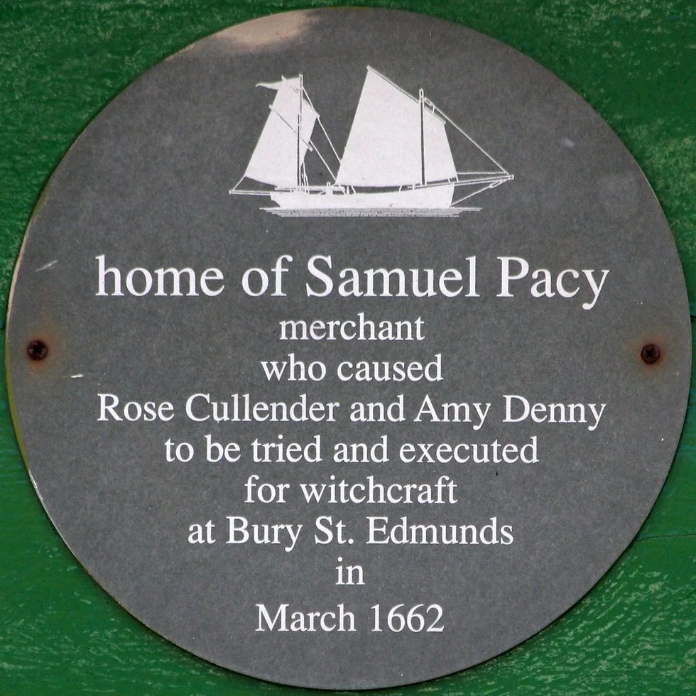 A circular plaque features a sailing ship engraving above text detailing the history of Samuel Pacy and a 1662 trial.