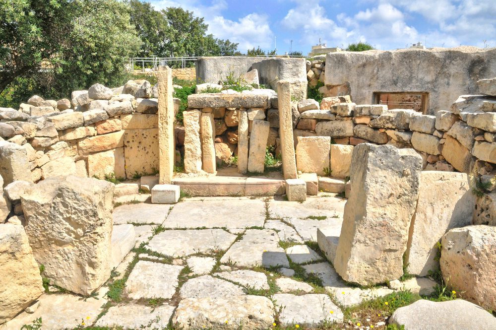 The complex is made primarily of large coralline limestone blocks, which have developed a weathered, pitted surface over time.