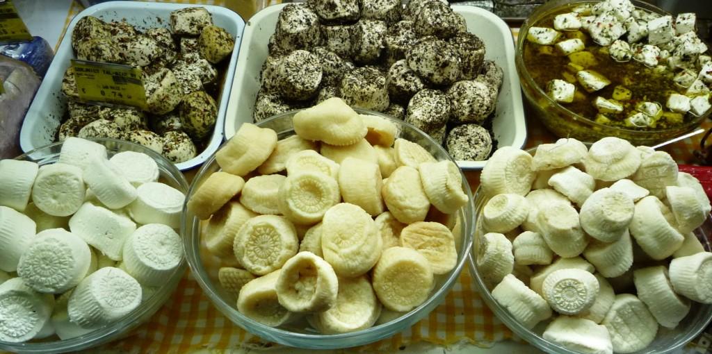 Malta_Gbejniet goats cheese, small balls of cheese of various ages sit in baskets