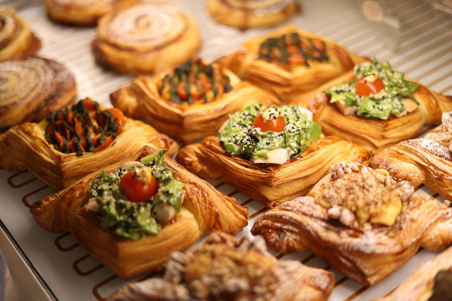 A vibrant array of gourmet Danish pastries showcasing various toppings, perfect for food lovers.