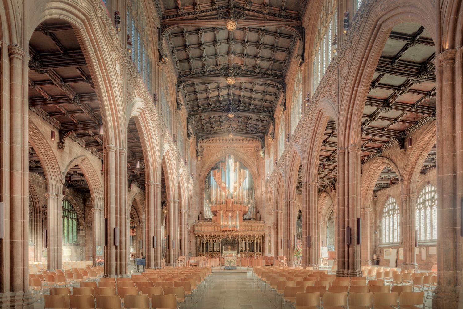 Explore the stunning Gothic architecture inside Manchester Cathedral.