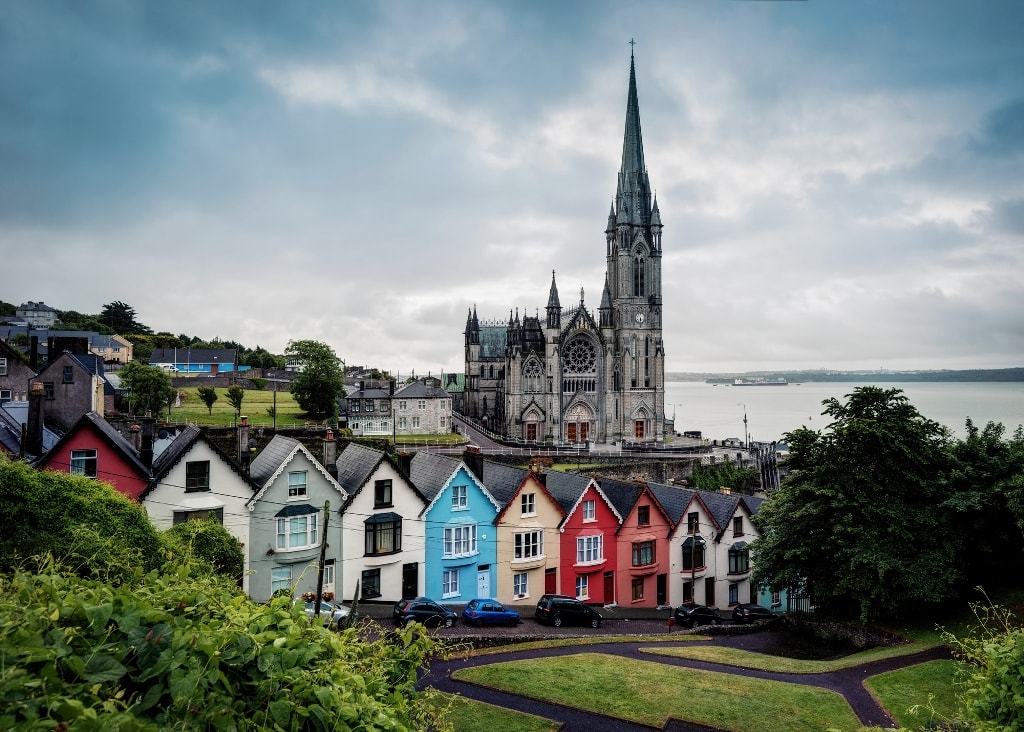 St. Colman and the deck of cards colourful houses in Cobh. Landmarks in Ireland you must visit