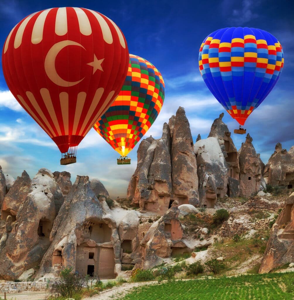 Hot air balloon turkey flag flying mountain valley Cappadocia Turkey