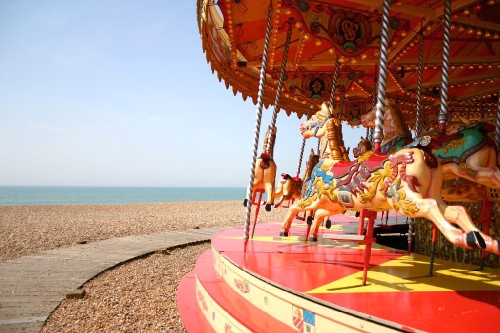 Merry-go-round on Brighton beach with blue sky beautiful cities in the UK