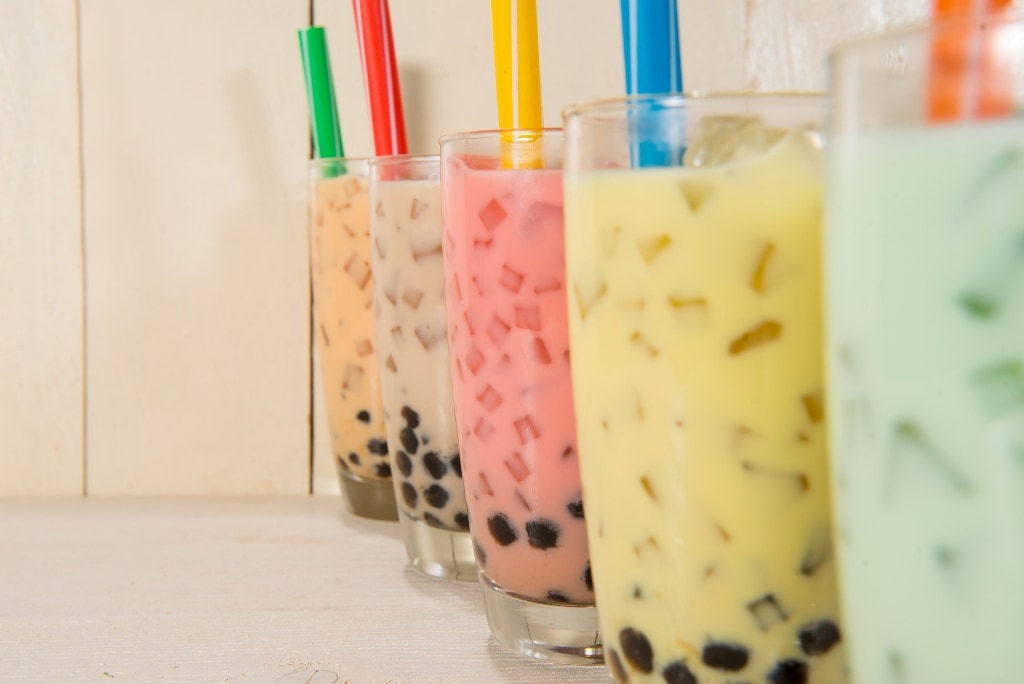 Boba / Bubble tea. Homemade Various Milk Tea with Pearls on wooden table.