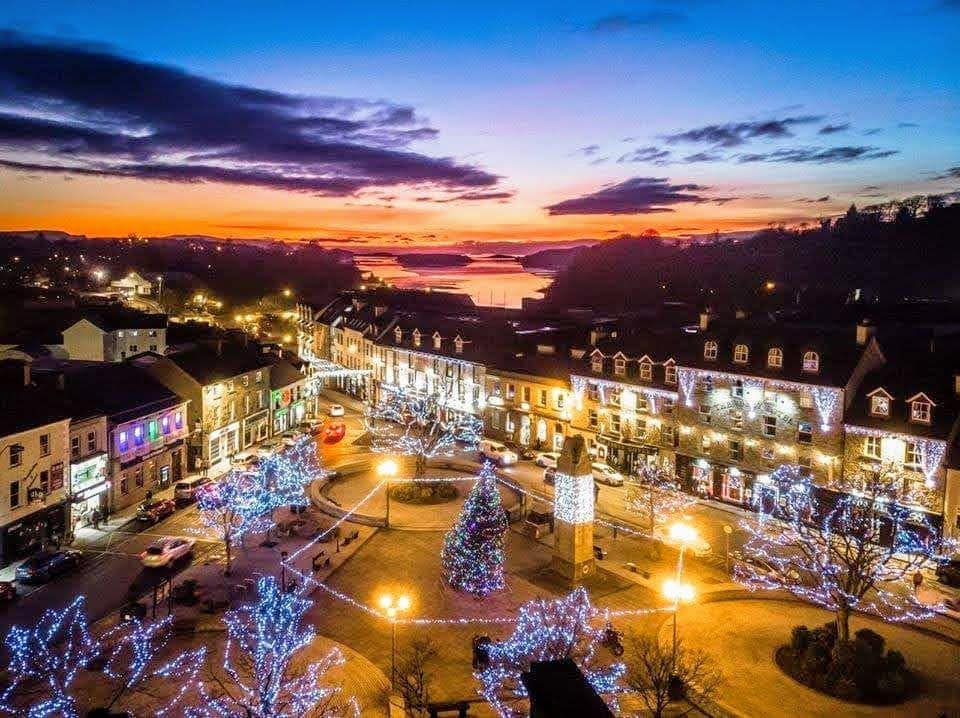 A view at dusk of the Diamond in Donegal Town with Donegal Bay in the distance. Around the Diamond are all the best restaurants in Donegal town.